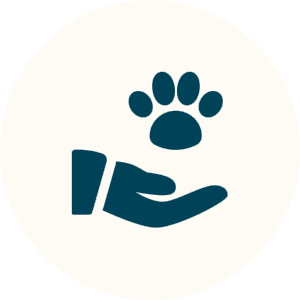 A hand holding a paw symbol, representing pet care.